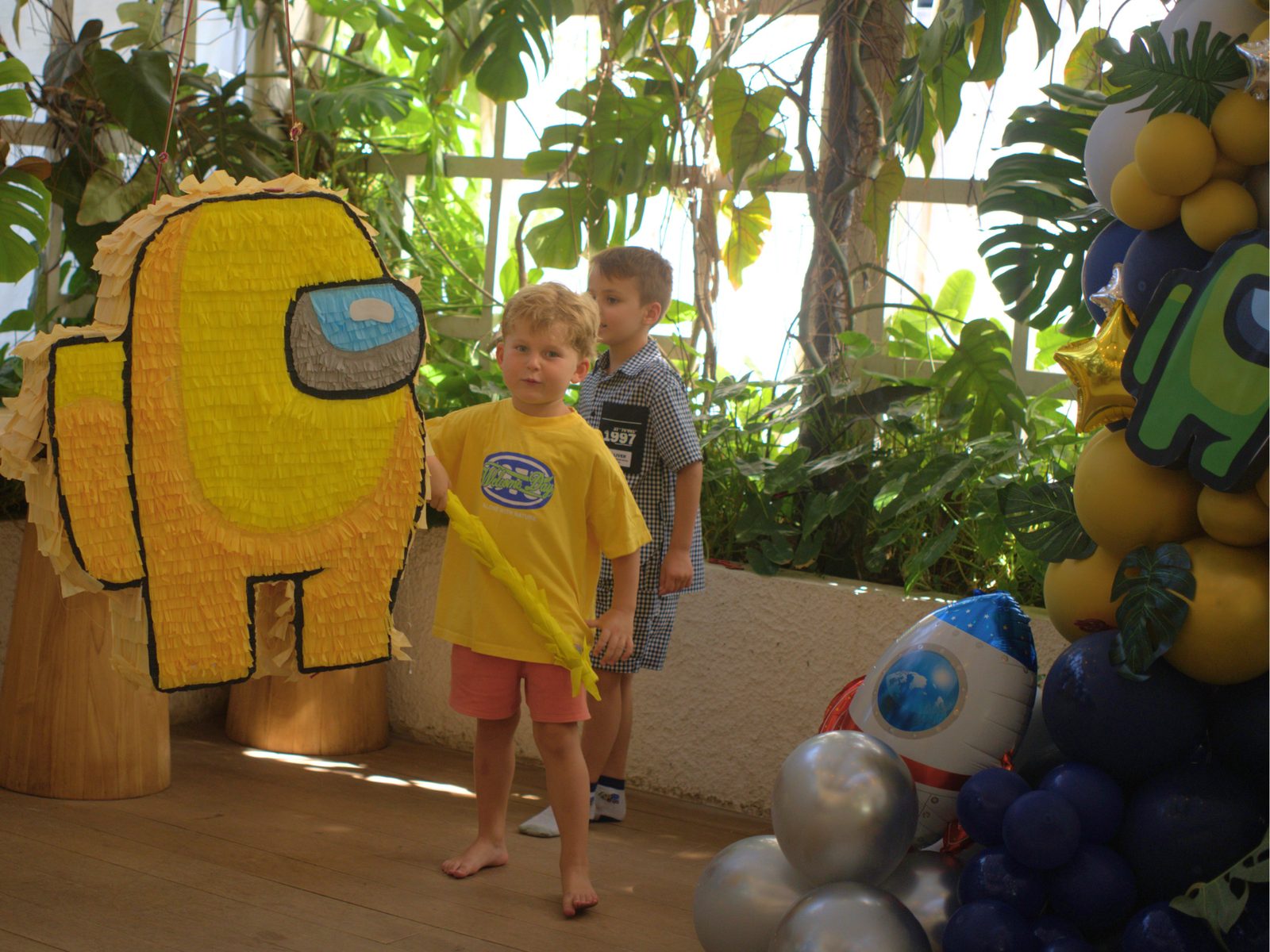 Child in front of a character balloon backdrop